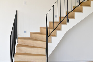 Wooden staircase in a new modern house, close up.