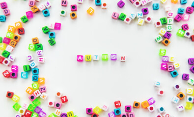 Child cubes word autism. Selective focus.