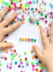 Child cubes and the word sister. Selective focus.