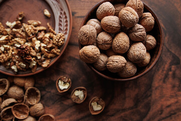 bowl with walnuts and walnuts on table