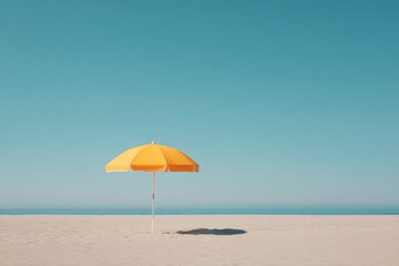 lone beach umbrella stands on pristine sand under bright summer sky