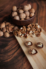 walnuts and hazelnuts on a wooden background.