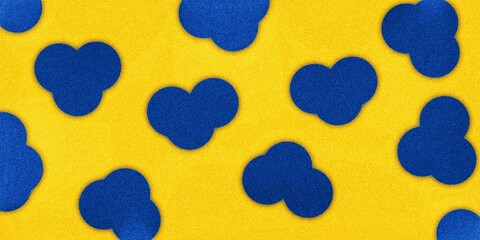 The bright yellow background is decorated with irregularly shaped blue spots, creating a cheerful...