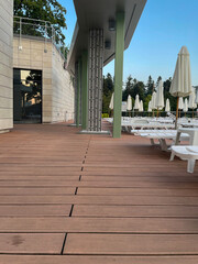 Deck chairs by an outdoor pool at a luxury resort