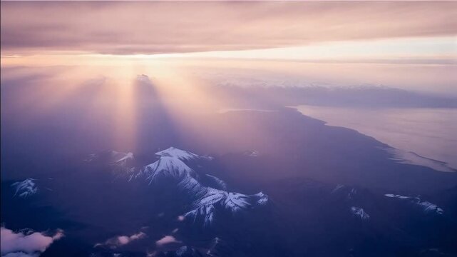 Aerial Journey Over Majestic Mountains at Dusk with Fading Light