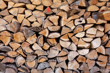 Stack of split firewood with natural textures
