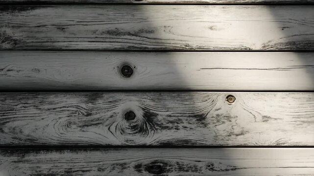 Aged pine wood with a vintage white texture backdrop. Distressed gray wooden surface. Top view of wood tabletop texture.