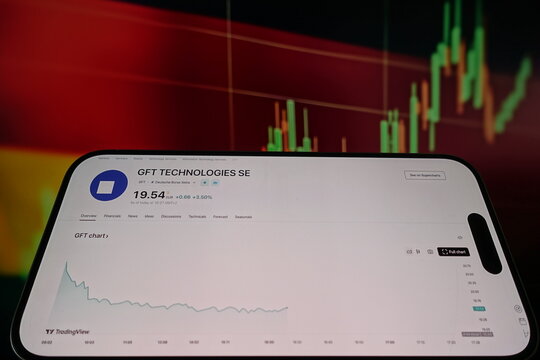 Kiel, SH, Germany, 10 Apr 2025: A smartphone displays the GFT Technologies SE stock chart with market details against a colorful financial graph backdrop