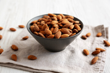 Roasted Almonds in a Bowl, side view. Close-up.