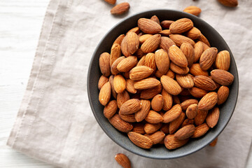 Roasted Almonds in a Bowl, top view. Space for text.