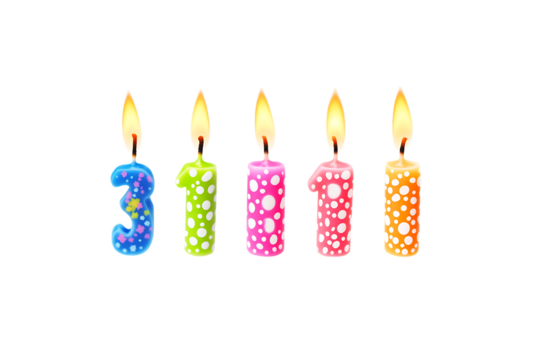 Colorful birthday candles with different patterns and lit flames arranged in a row on a white background