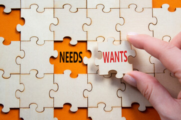 Wants and Needs symbol. Concept word Wants and Needs on wooden blocks. Businessman hand. Beautiful...