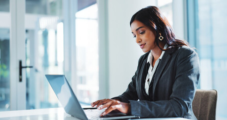 Laptop, accountant and business woman typing financial report, budget review and bookkeeping....