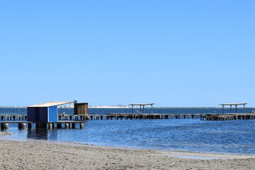 Beautiful white sand beach with a jetty and spa in calm waters