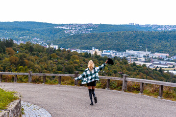 Woman escaping the city life in a public park on a hilltop in Stuttgart, Germany