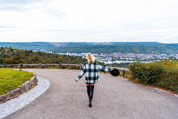 Woman walking in nature on a hilltop in the city of Stuttgart, Germany