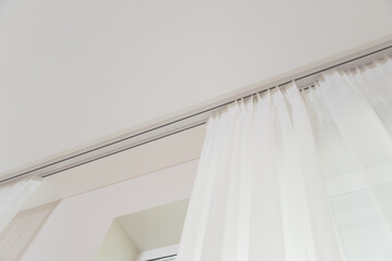 White light gathered tulle on a white cornice © Syoma Barva