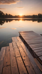 Obraz premium Sunset over a tranquil lake with wooden docks, reflecting the warm colors of the sky.