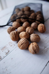 walnuts on light wooden background