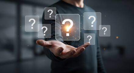 Questions Abound: Man Holding Inquiry Icons - Seeking Answers, Solutions & Clarity | FAQ, Support, Uncertainty, Innovation