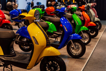 small-capacity scooters at a motorcycle exhibition. colorful scooters for the stand