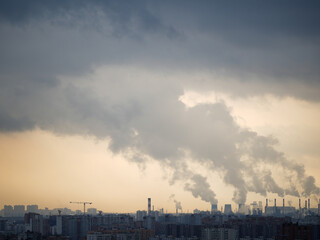 Panoramic view of a city with numerous residential buildings and an industrial area in the...