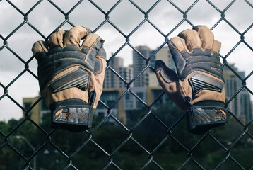 Climbing up a chain link fence.