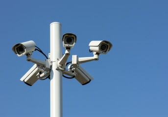 Cameras on pole with blue sky