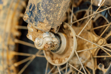 dirty off-road enduro motorcycle wheel. dirt motorcycle tire from off-road racing