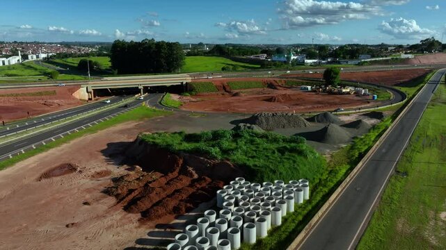 High-angle aerial view of highway infrastructure development. Construction of the access road to Shopping Botucatu, on the Teacher Joao Hipolito Martins Highway (SP-209). 12-24-2024