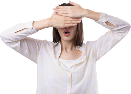 Portrait of a serious young woman showing stop gesture with her palm over white background