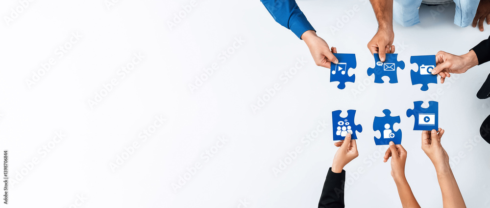 Fototapete This image showcases individuals collaboratively assembling colorful puzzle pieces, representing various concepts and ideas, emphasizing teamwork and creativity in a modern environment. Amity