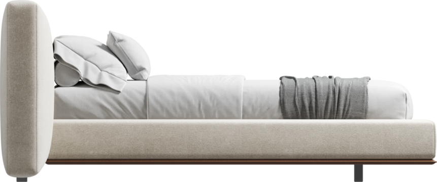 Side view of double bed with headboard and blanket	