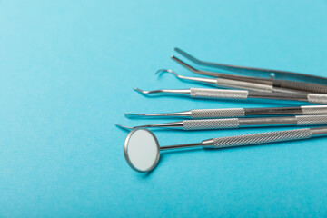 Dentist tools on a blue background. Dentist Concept.Teethcare, dental health concept. Means to care...