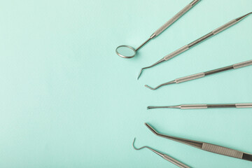 Dentist tools on a blue background. Dentist Concept.Teethcare, dental health concept. Means to care for the oral cavity. Dental model and dental equipment. Dental hygiene. Space for text. Copy space.