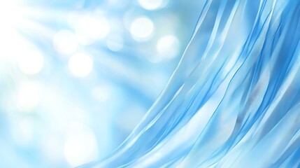 Beautiful flowing light blue fabric against a soft blurred background