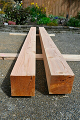 Freshly sanded old growth fir beams, stained and ready to be used for building home renovation deck project