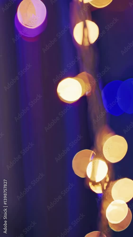 Poster abstract bokeh lights in warm tones with a vertical camera angle, creating a dreamy, festive video b