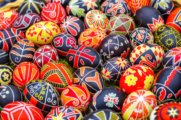 Traditional ornamets on Easter egg -Ukrainian pysanka.Mix of colored easter eggs with the traditional ukrainian slavic designs.Preparation for Christian holiday.