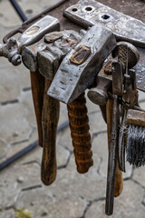 Blacksmith tools on the outdoors.Hand anvil. hummers all blacksmith tools in forge.