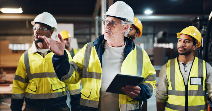 Tablet, people or manager in carpentry warehouse for furniture manufacturing, renovation or labor. Mentor, apprentice or mature carpenter talking for production, remodeling maintenance and research