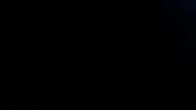 Pack of video transitions featuring bursts of light beams and soft bokeh effects. Transition glowing light movements across a black background with lens flares and light leaks, as cinematic.