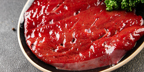 Raw liver beef veal meat steak liver grill dish fresh gourmet food background on the table rustic...