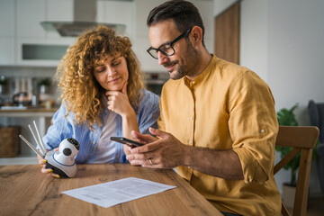 Couple at home connect and install cctv security surveillance camera