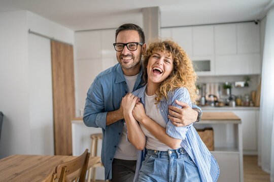 Happy adult caucasian couple at home husband and wife family concept