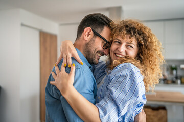 Happy adult caucasian couple at home husband and wife family concept