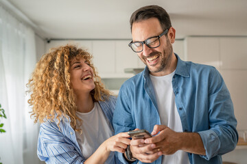 Happy adult caucasian couple at home husband and wife family concept