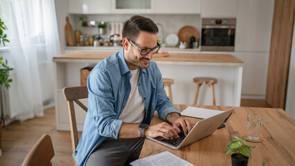 one man adult caucasian work on laptop at home happy smile