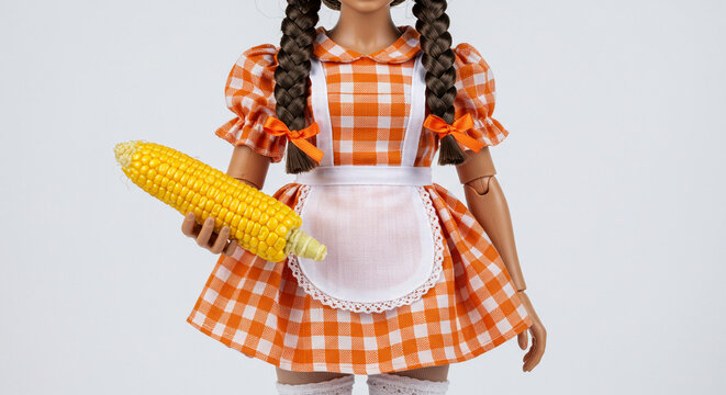 Doll in Traditional Festa Junina Dress Holding a Corn