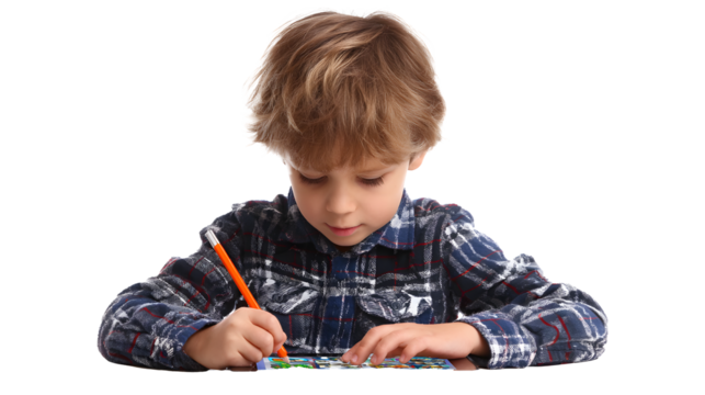Focused young boy wearing a plaid shirt, concentrating on drawing with an orange pencil. Education, creativity, and early development are key.